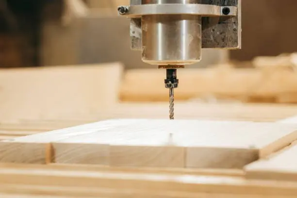 CNC spindle is processing the wood