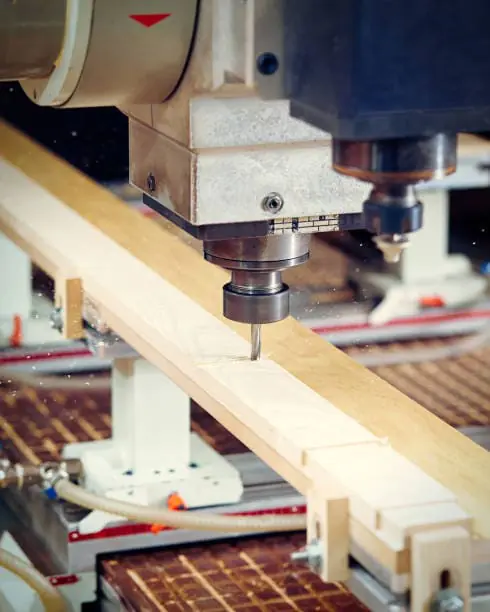 CNC spindle is processing the wood